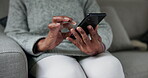Hands, old person and smartphone, typing and chat with communication, social media and closeup while at home. Using phone, mobile app and internet, connectivity with text writing and relax on couch