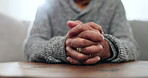 Hands, praying and closeup for faith, home and gratitude with peace, mindfulness and religion on table. Person, prayer and hope with praise, worship and meditation for connection with holy spirit