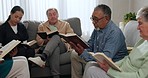 Senior people, bible study and reading in lounge with pastor, friends or family with religion, faith and worship in home. Men, women and book for peace, learning or mindfulness with holy spirit guide