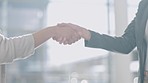 Closeup, handshake and office for agreement, welcome and respect with kindness, hiring or recruitment. Business people, woman and manager with shaking hands, onboarding or human resources at agency