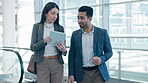 Walking, tablet or teamwork with business people speaking of research or consulting about a report. Coaching, training or employees review a website on Internet for networking, meeting or planning
