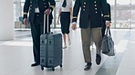 Luggage, airport and pilot walking together with bag for flight, schedule or international transportation job. Men, suitcase and team together for global travel, airplane and ready to start boarding