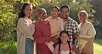 Happy big family, nature and bonding together in park for quality time, vacation or outdoor holiday. Portrait of parents, grandparents and children smile in happiness for travel, trip or weekend