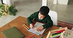 Creative, boy and home with home education, learning and color activity for development. Book, school homework and young child with student growth and drawing in a house with paper and illustration