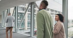 Back, airport and luggage with business people walking together for an international trip while planning. Suitcase, teamwork or collaboration with a man and woman employee in a terminal for travel