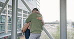 Airport, business woman and husband hugging his wife to welcome her with a greeting after travel arrival. Love, global and international with an excited couple embracing on a terminal bridge indoor