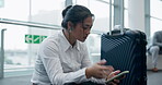 Woman, phone and delay time at an airport while exhausted, angry and tired of waiting. Travel luggage, late and upset asian person stress with a smartphone and watch to check boarding schedule