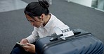 Woman, stress and delay with a phone at an airport while exhausted, angry and tired of waiting. Travel, late and upset asian person with luggage and smartphone to check boarding or flight schedule