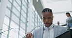 Justice, elevator and a black man lawyer reading a case file while in an office in preparation of a trial. Legal, law and documents with a male attorney looking at research, information or evidence