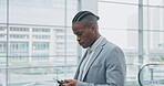 Phone, black man typing and escalator for business, travel and email in airport. Mobile, consultant and serious African person walking in lobby with smartphone for internet, reading and social media