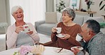 Funny, retirement and senior friends at a tea party together during a visit in a home for bonding. Comedy, community and support with a group of elderly people in a living room for a social gathering