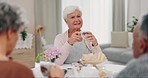 Senior women, friends and tea party conversation with care, listening and drink in retirement in house. Elderly group, chat and relax with reunion, coffee or espresso at brunch with listening in home