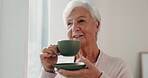 Thinking, tea and a senior woman drinking from a cup in the living room of her nursing home during retirement. Face, smile or relax and an elderly female pensioner feeling nostalgia with a beverage