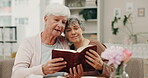 Worship, friends and bible study with old women and books for praying, peace and mindfulness. Help, learning and Christian faith with senior people in living room at home for care and gratitude