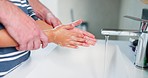 Parents, kid and washing hands in bathroom with soap, water and teaching healthy hygiene for bacteria, dirt and germs at home. Closeup, child and cleaning palm at tap for safety, self care or routine