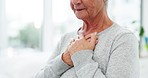 Grief, senior woman and hands to heart at retirement home with chest pain, anxiety and depression. Cancer news, elderly female person and patient in a clinic or nursing hospital with bad diagnosis