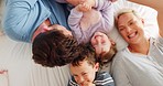 Parents, kids and playing on bed in top view with bonding, comic laugh and funny game in family house. Mother, father and young children with quality time, tickling and happy together in home bedroom