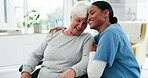 Medical, black woman nurse hugging a senior patient in a wheelchair and support in a hospital. Healthcare, trust and a medicine professional in a clinic with a mature female person with a disability