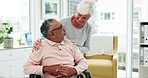 Elderly, interracial couple and conversation in retirement home with marriage and love. Wheelchair, senior man and woman together with empathy, care and support in nursing clinic for health