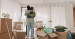 Hug, happy couple and celebrate moving house with boxes in a room. New home, gratitude and love of a black man and woman at property with commitment, loan and help with apartment mortgage or rent