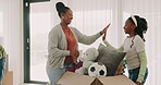 High five, mother or happy child in new home with boxes for packing as a black family on real estate with success. Dream house, excited or African girl with a proud mom to celebrate relocation goals