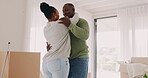 Black couple, moving in and dancing to celebrate at home in a room for fresh start. New house, happy man and a woman at a property with commitment, help and support for apartment mortgage or rent