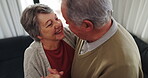 Dance, love and an elderly couple in their home for playful romance together during retirement. Smile, relax or funny with a happy senior man and woman moving to music in a living room closeup