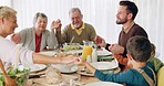 Praying, family and holding hands at lunch for worship, gratitude or respect before eating at home. Brunch, prayer and kids with parents, grandparents and food, love and grace for meal and nutrition