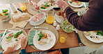 Above, food and family at table in home for meal, gathering of celebration of event with cooking, eating and healthy dinner. Lunch, meat and hands sharing or serving chicken on plate in dining room