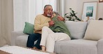 Love, hug and old couple on sofa with smile, marriage anniversary and quality time together in living room. Relationship in retirement, happy woman and senior man relax on couch with playful bonding.