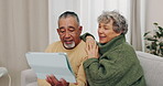 Tablet, happy and search with old couple on sofa for communication, streaming and relax. Social media, smile and retirement with senior man and woman in living room at home for technology and love