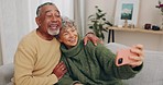 Senior couple, couch and selfie with smile, hug or relax with web blog, post or love for bonding in home living room. Old man, elderly woman and happy for meme, social network or photography in house