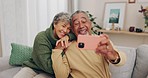 Happy senior couple, couch and selfie with smile, holding hands or relax on blog, post or love for bonding in home. Old man, elderly woman and smile for meme, social network and photography in house