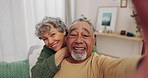Senior couple, face and selfie in home with smile, excited and relax with blog, post or love for bonding in lounge. Old man, elderly woman and happy for meme, social network and photography in house
