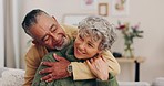 Happy, hug and calm senior couple at home in marriage and retirement with love, support and care. House, living room and elderly people relax on a lounge sofa with embrace and romance with smile 