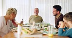 Happy family, lunch and laughing at a dining table while talking, bonding and relax in their home together. Food, brunch and kids with parents, grandparents and funny conversation while sharing meal