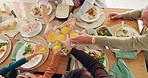 Lunch, cheers and family with juice in the dining room for health, wellness and nutrition meal. Toast, celebrate and closeup of people with a fruit beverage at a brunch or breakfast event at home.