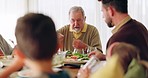 Lunch, family and grandfather eating at the dining table for a health, wellness and nutrition meal. Talking, hungry and senior man enjoying a brunch, breakfast or supper at his modern home for dinner