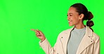 Green screen, woman face and hand pointing in studio for information. promotion or announcement on mockup background. happy, portrait and female model show news, review or feedback, deal or giveaway