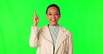 Green screen, happiness and woman advertising, pointing up and gesture at mockup space, sales promotion or commercial. Discount information, chroma key portrait and brand person on studio background