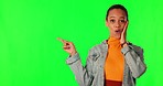 Green screen, mockup or woman surprise, pointing and looking at promo notification, news announcement or sales deal. Wow discount space, chroma key portrait or shocked person OMG on studio background