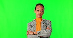 Angry, woman and arms crossed on green screen with frustrated, moody and grumpy attitude on studio background. Mad, hurry and gen z person or model snapping fingers for fast service or attention