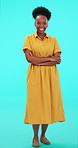 Laughing, funny and woman wink in studio for secret or flirting on a blue background. Happy African person portrait with arms crossed for positive energy, mindset or fashion style for promotion deal