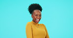 Happy, black woman and face with a wink, emoji or secret signal for gossip or fun on blue background in studio. African, portrait and person with a smile with fashion, natural beauty or cosmetic tips