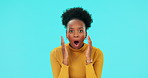 Face, wow and omg with a black woman on a blue background in studio looking shocked. Portrait, surprise or wtf and an afro female person with a reaction to an announcement, gossip or a secret