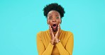 Face, wow and surprise with a black woman on a blue background in studio looking shocked. Portrait, omg or wtf and an afro female person with a reaction to an announcement, gossip or a secret