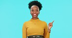 Face, black woman and pointing to mockup, happy and studio isolated on a blue background. Portrait, copy space and person with hand for advertising, marketing or commercial promotion for branding