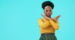 Serious, face and woman with stop sign in studio for warning, alert or prohibition symbol. Upset, angry and portrait of African female model with rejection hand gesture by blue background with mockup