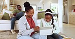 Black family, mother and girl with a tablet, floor and typing with live streaming, cartoons or happiness. Home, mama or female child in a lounge, technology or social media with network or connection