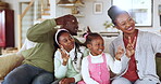 Funny, selfie and happy black family in home, living room or parents, kids and relax on lounge, sofa or couch on holiday. Black couple, children and hands sign for love, peace or together with phone